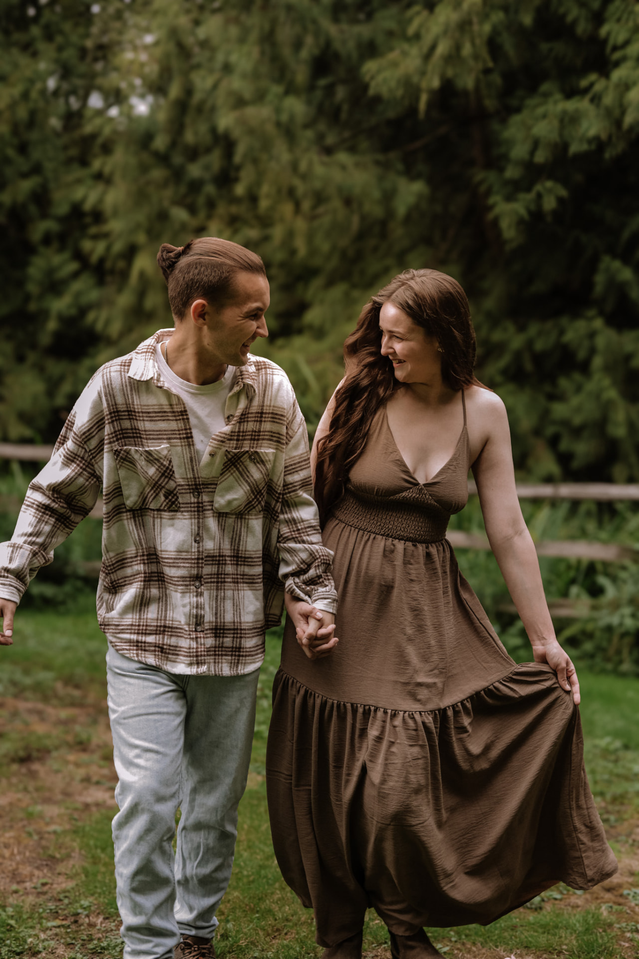 Couple walking hand in hand and laughing