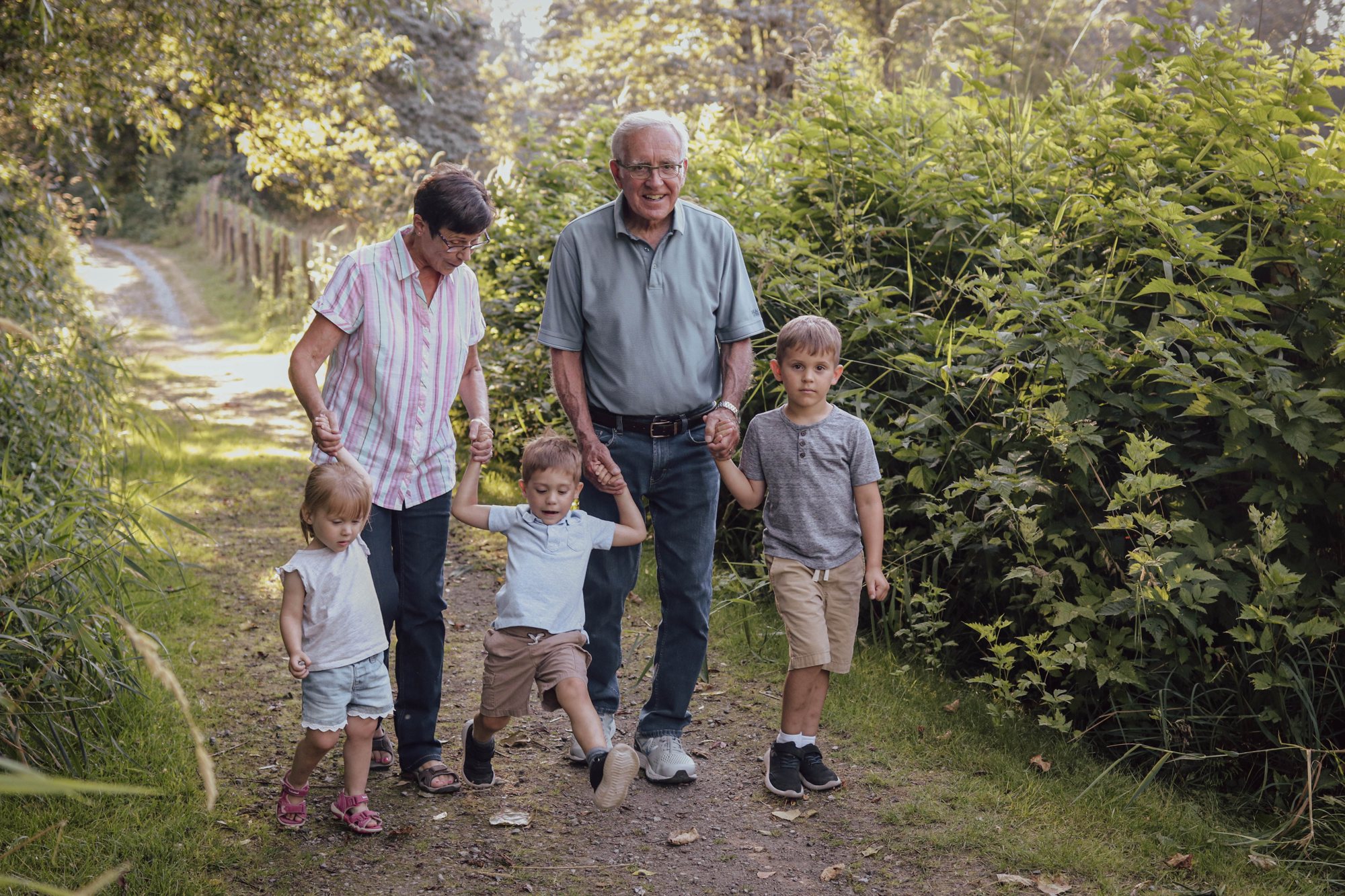 Grandparents walking with grandkids — McManus Photography